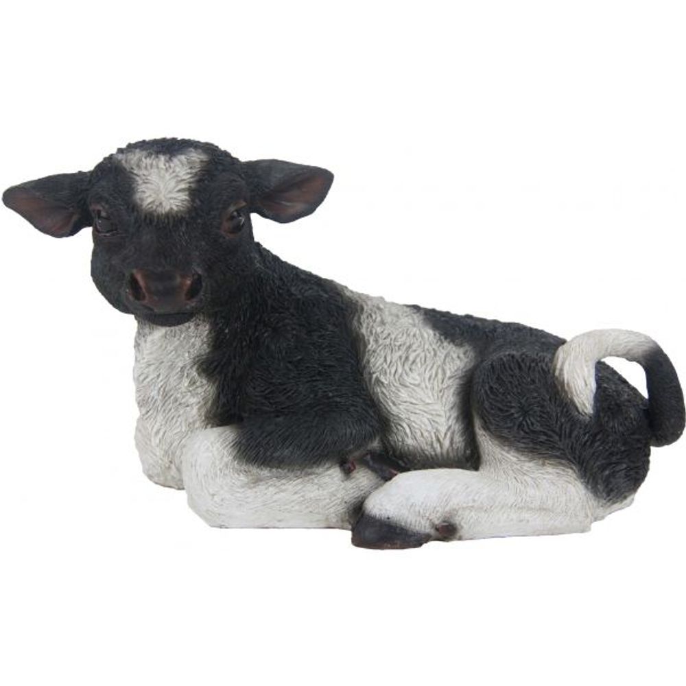 Veau noir et blanc couché en résine petit modèle