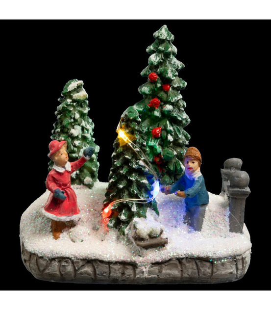 Village de noël lumineux scène de vie avec personnages et sapins