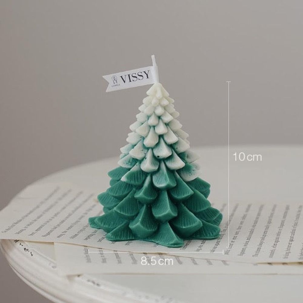 Bougie de noël - sapin vert enneigé