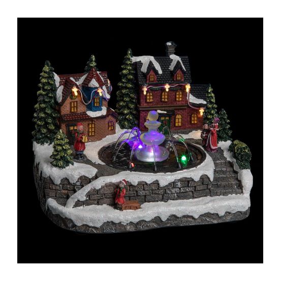 Village de noël lumineux et mouvement d'eau scène de vie autour d'une fontaine