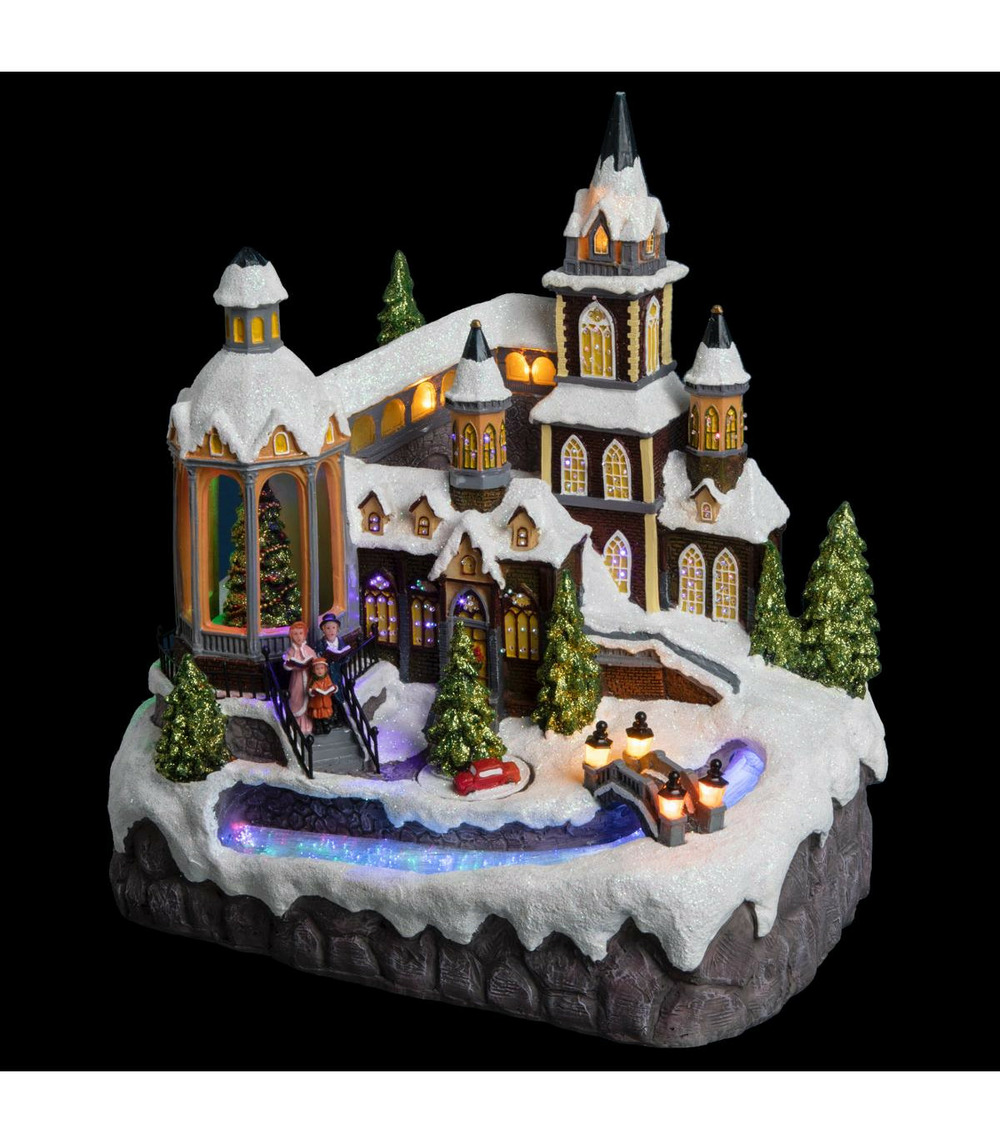 Village de noël lumineux et animé eglise avec rivière