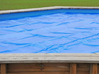 Bâche à bulles pour piscine bois octogonale canelle 5,51 x 3,51 m
