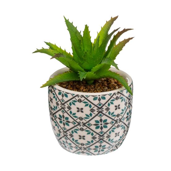 Plante artificielle verte dans un pot en céramique