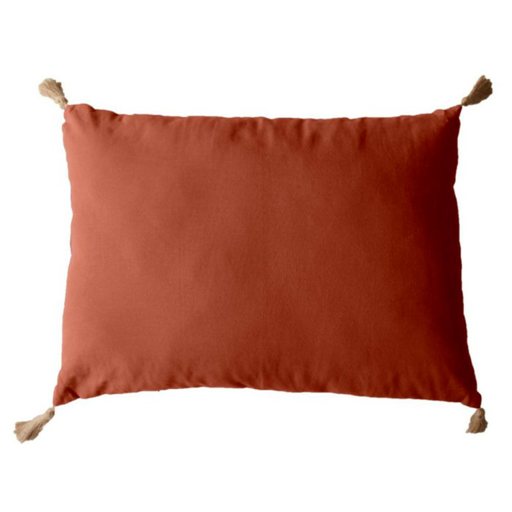 Coussin déco uni à pompons 