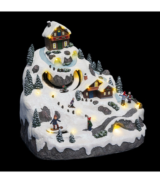 Village de noël lumineux, animé et musical vacances à la montagne