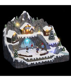 Village de noël lumineux, animé et musical maisons autour d'un etang gelé