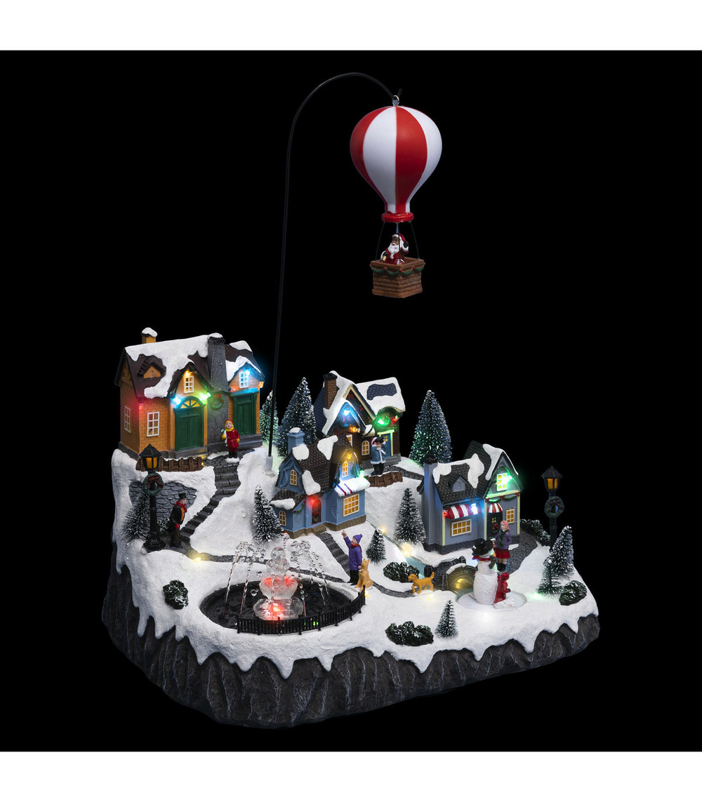 Village de noël lumineux, animé et musical père noël dans sa mongolfière