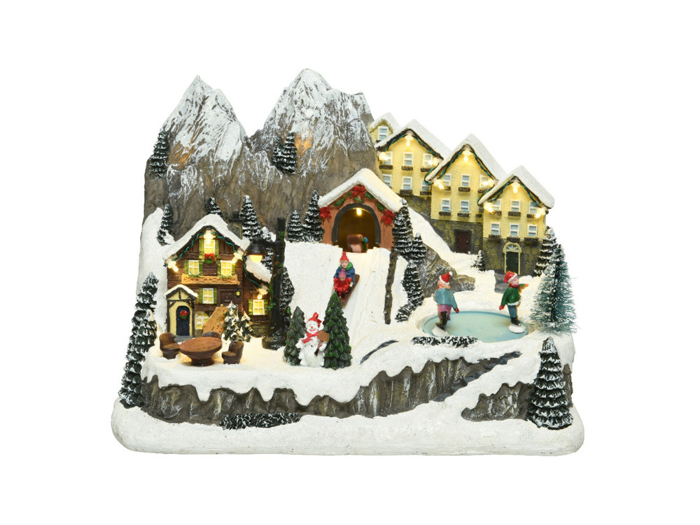 Village de noël illuminé avec chalets enneigés - nos envies deco