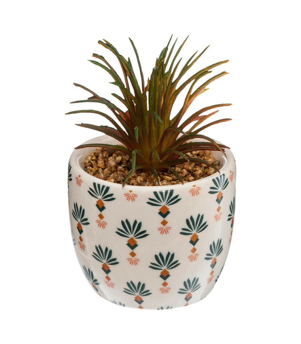 Plante artificielle verte dans un pot en céramique