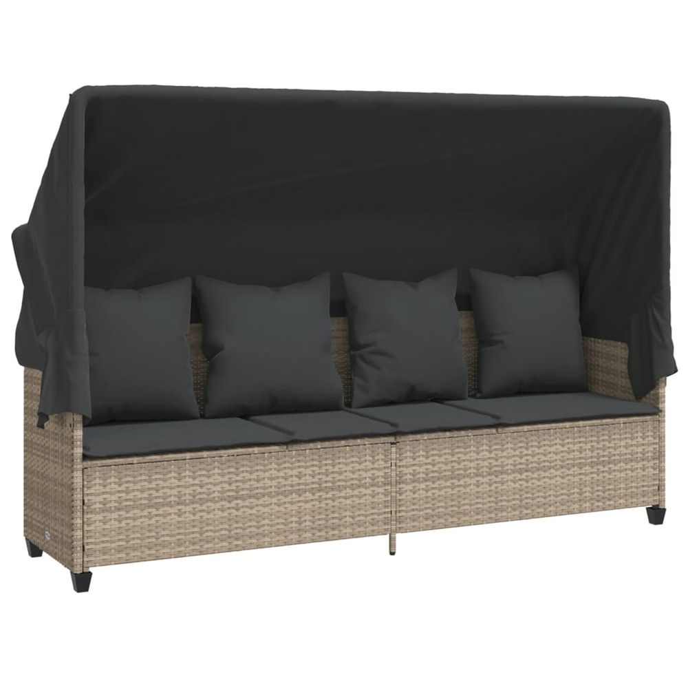 Chaise longue avec auvent et coussins gris clair résine tressée bain de soleil