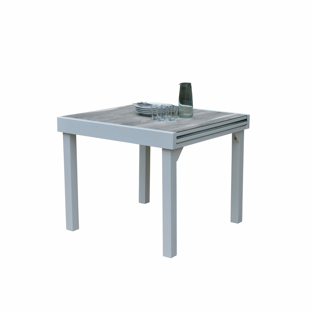 Table modulo 4/8 personnes structure aluminium blanche, plateau en verre décors bois