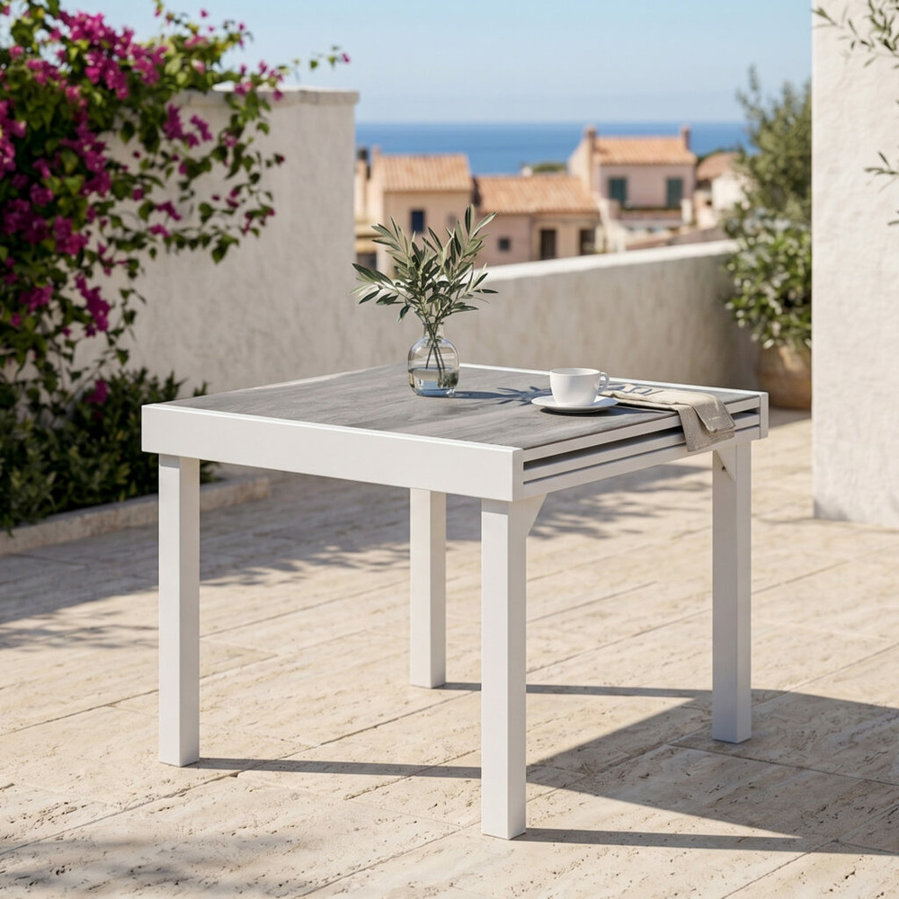 Table modulo 4/8 personnes structure aluminium blanche, plateau en verre décors bois