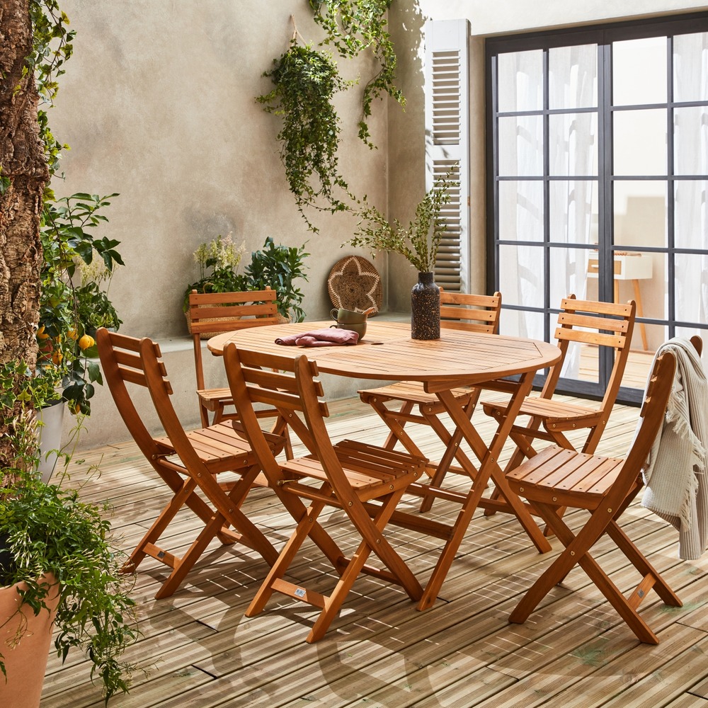 Table de jardin pliable 150cm en bois d'acacia déjà huilé. Forme ovale avec 6 chaises pliables