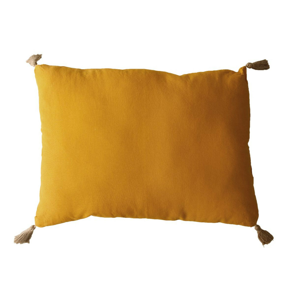 Coussin déco uni à pompons 