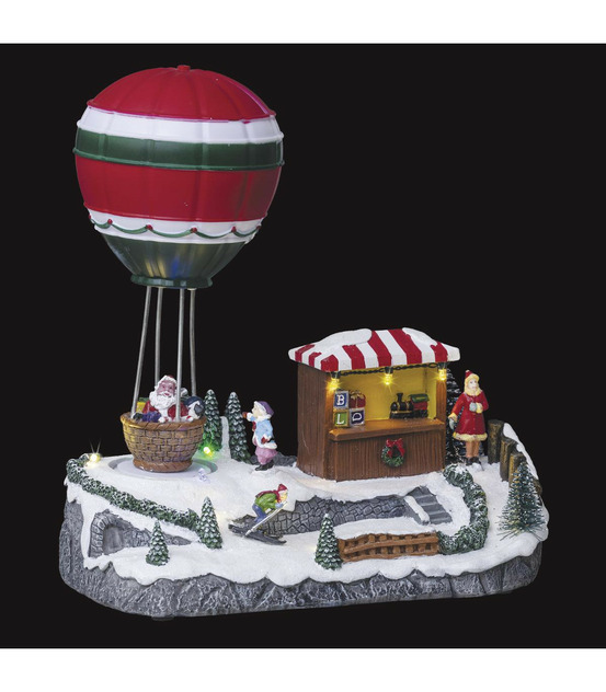 Village de noël lumineux et animé manège ballon du père noël