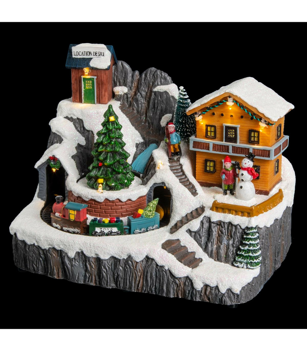 Village de noël lumineux, animé et musical scène de vie autour du chalet à la montagne