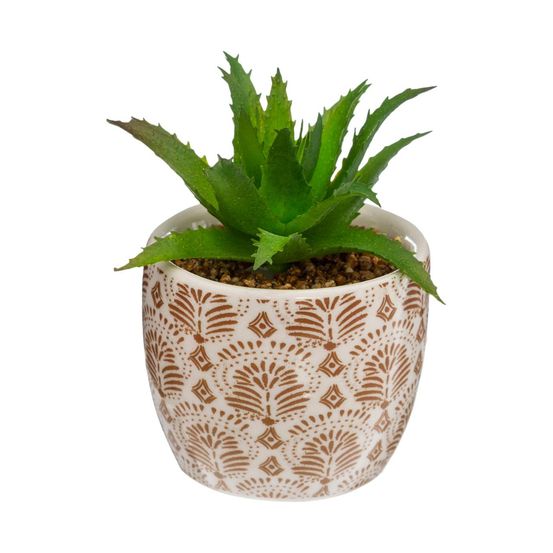 Plante artificielle verte dans un pot en céramique