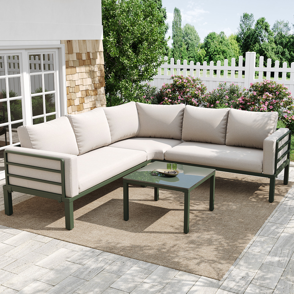 Mobilier jardin 4-5 pers: table basse verre, acier zingué vert, coussins beiges, pieds réglables