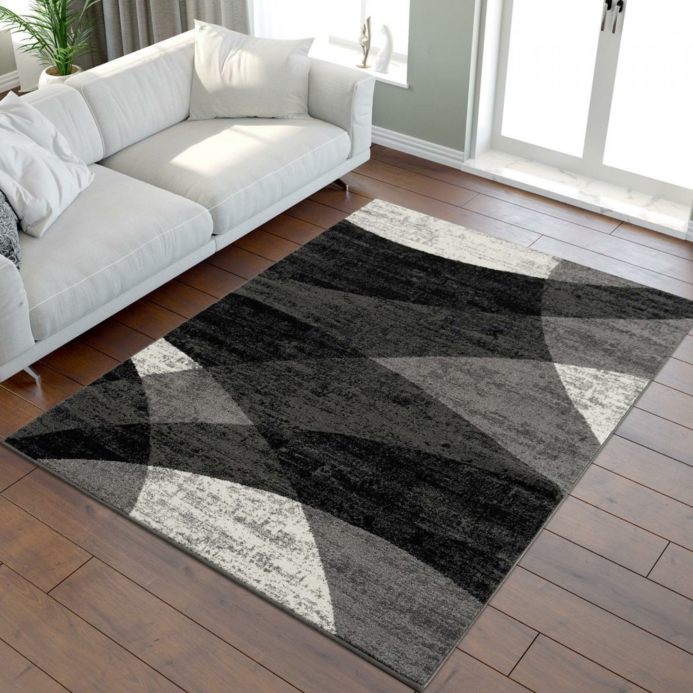 Tapis salle à manger 200x290 tissé noir rectangle motif géométrique faldo