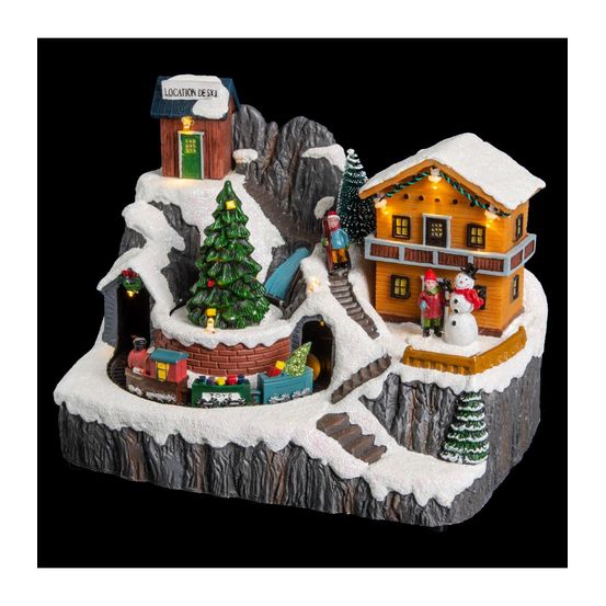 Village de noël lumineux, animé et musical scène de vie autour du chalet à la montagne