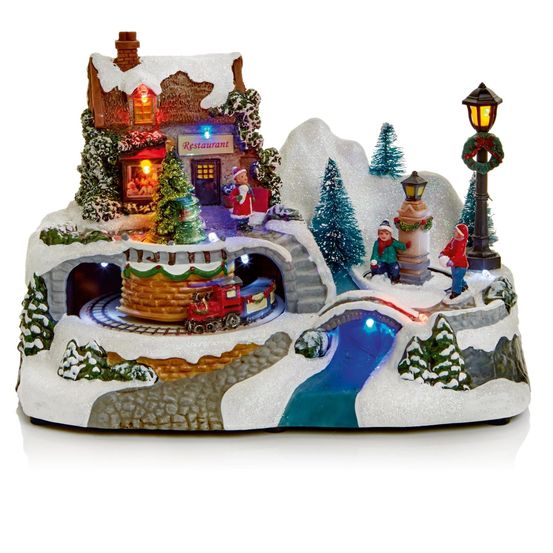 Village illuminé de noël - village enneigé avec son restaurant