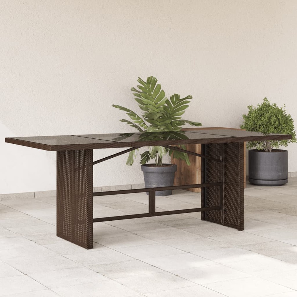 Table de jardin avec dessus en verre marron résine tressée