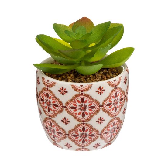 Plante artificielle verte dans un pot en céramique