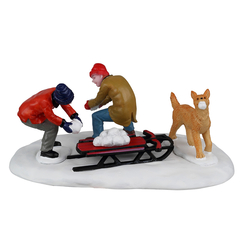 Figurine : Villageois jouant dans la neige avec leur chien